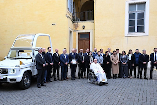 Pope Francis with the Mercedes-Benz team and the new specially-designed popemobile