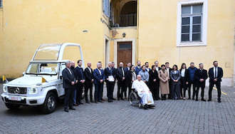 Pope Francis with the Mercedes-Benz team and the new specially-designed popemobile