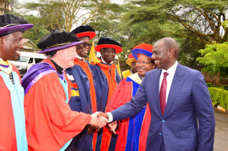 President William Ruto greeting Fr Padraig Devine