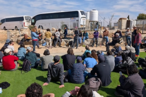 Volunteers listening to member of the community talk about the situation in their village. Image: RHR