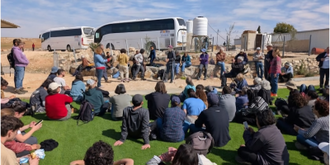 Volunteers listening to member of the community talk about the situation in their village. Image: RHR