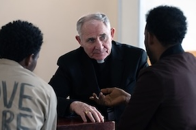 Bishop Paul talks with asylum seekers