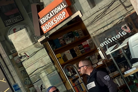 Police stand outside bookshop