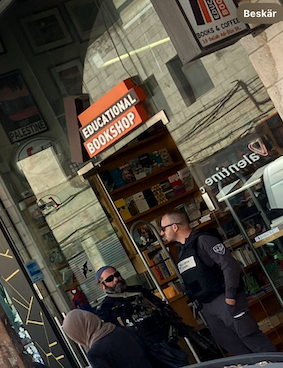 Police stand outside bookshop