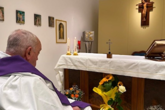 Pope prays after celebrating Mass in hospital