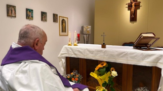 Pope prays after celebrating Mass in hospital