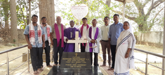 Group at the tomb of Fr Herman Rasschaert, SJ