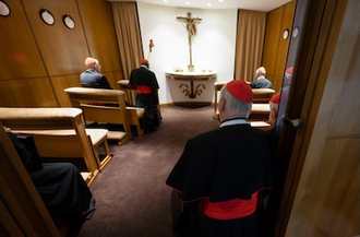Cardinals pray before the Blessed Sacrament in chapel near the New Synod Hall - Vatican Media