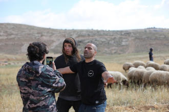 Illegal settlers attack RHR activist.   Image: RHR
