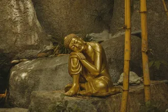 Buddha statue on rock. Ho Chi Minh City Vietnam. Photo by Kloud Walker on Unsplash