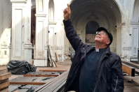 Fr Jaime Tocornal in the ruined church after the 2020 attack © ACN