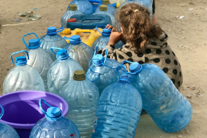 Queues for small amounts of water take hours. Any food hard to find.  Photo by Emad El Byed on Unsplash