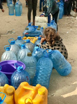 Queues for small amounts of water take hours. Any food hard to find. Photo by Emad El Byed on Unsplash