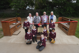 Patrick McKeown, left, with representatives from Wooden Spoon alongside pupils at St John Fisher Catholic Primary School, Coventry