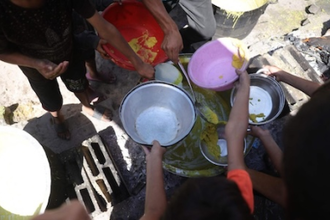 Palestinian children waiting for meagre food handouts in Gaza. Image: Vatican Media