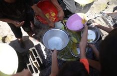 Palestinian children waiting for meagre food handouts in Gaza. Image: Vatican Media