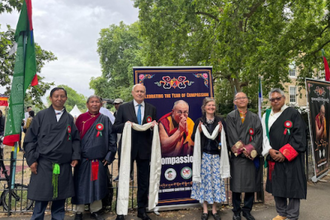 Sir Ian Duncan Smith and guests at the Tibetan Peace Park celebration for the Dalai Lama's 90th birthday and the Year of Compassion