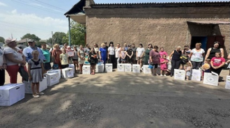 Families in Kharkiv receiving aid parcels