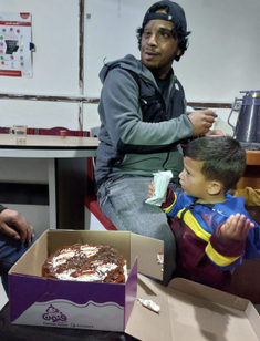 Awdah with his son and the cake Maureen left for him - on what was to be his last birthday.