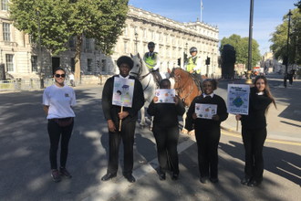 Jules Gibson from Jesuit Missions with St Ignatius pupils Isiah Meme, Sheniece Mills, Teyana Taylor and Skaiste Simson in Whitehall