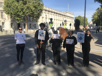 Jules Gibson from Jesuit Missions with St Ignatius pupils Isiah Meme, Sheniece Mills, Teyana Taylor and Skaiste Simson in Whitehall