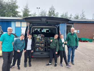 Generous St Alban's pupils delivering their donations to the Wirral Foodbank