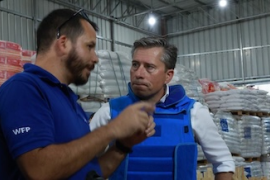 Tom Fletcher talks to a UN humanitarian worker shortly after entering Gaza on Friday.