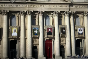Screenshot showing St Peter's Basilica at the Mass today with pictures of the seven new saints.