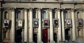Screenshot showing St Peter's Basilica at the Mass today with pictures of the seven new saints.