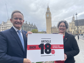 John Pontifex, Religious Freedom in the World report editorial board member and Dr Caroline Hull launching the petition in front of Parliament © ACN
