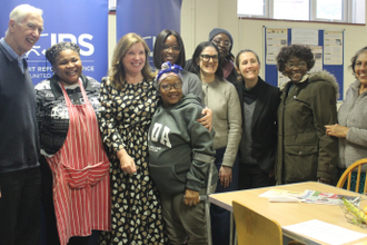 Dame Rachel with some of the family members she met during her visit to the JRS UK Centre