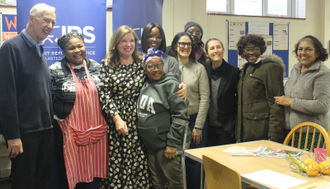 Dame Rachel with some of the family members she met during her visit to the JRS UK Centre