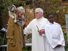 Martin and Bobo with Fr Tom Forde at a parish pet blessing at Our Lady Help of Christians in 2009.