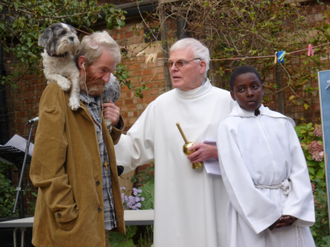 Martin and Bobo with Fr Tom Forde at a parish pet blessing  at Our Lady Help of Christians in 2009.