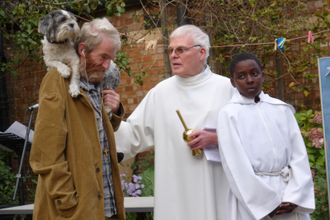 Martin and Bobo with Fr Tom Forde at a parish pet blessing  at Our Lady Help of Christians in 2009.