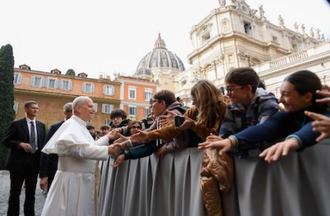 Pope greets students before the meeting
