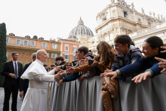 Pope greets students before the meeting
