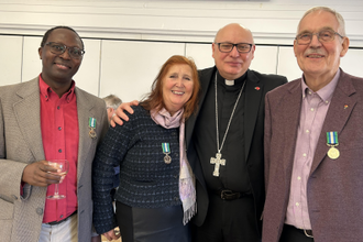 At the reception after Mass: Mugeni Sumba, Clare Dixon and Julian Filochowski with their special Medals awarded by Archbishop John Wilson