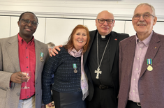 At the reception after Mass: Mugeni Sumba, Clare Dixon and Julian Filochowski with their special Medals awarded by Archbishop John Wilson