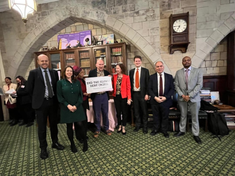 Alex Macqueen with MPs at Parliament, Credit: CAFOD