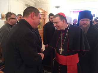 Cardinal Koch greeting Peter Humeniuk, one of ACN's Eastern Europe project heads, at February 2019 ecumenical conference in Moscow © ACN.