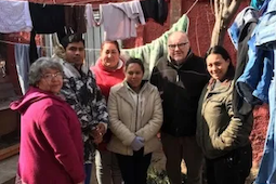Dan Harding with migrants in Chile