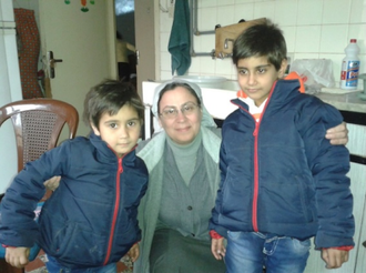 Sister Annie Demerjian with displaced girls in Aleppo. File image: ACN