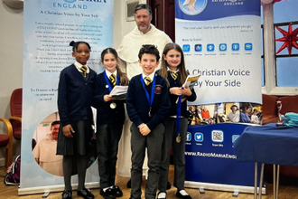 Fr Toby with the winning young broadcasters