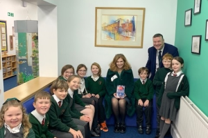 Samantha Giles with headteacher Mr John McDonald and pupils