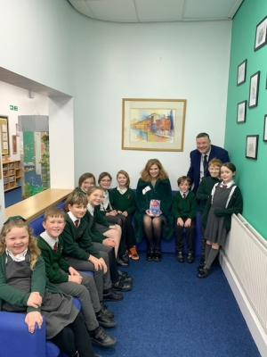 Samantha Giles with headteacher Mr John McDonald and pupils