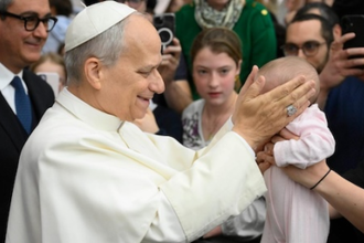 Pope blesses one of the youngest pilgrims yesterday. Image: Vatican Media
