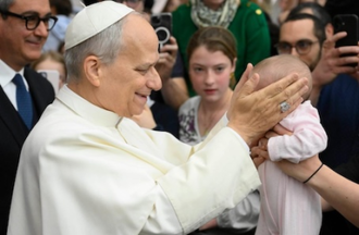 Pope blesses one of the youngest pilgrims yesterday. Image: Vatican Media