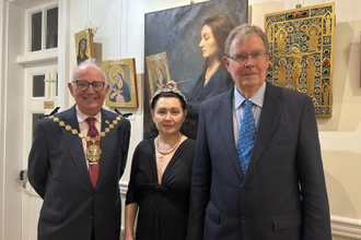 Mayor Dimoldenberg with Dr Irina Bradley and her husband Jerry at the exhibition. ( The large painting behind them is a portrait of Irina.)