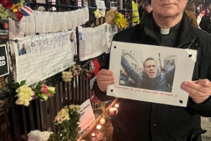 Father John McGowan at Monday's vigil for Alexei Navalny